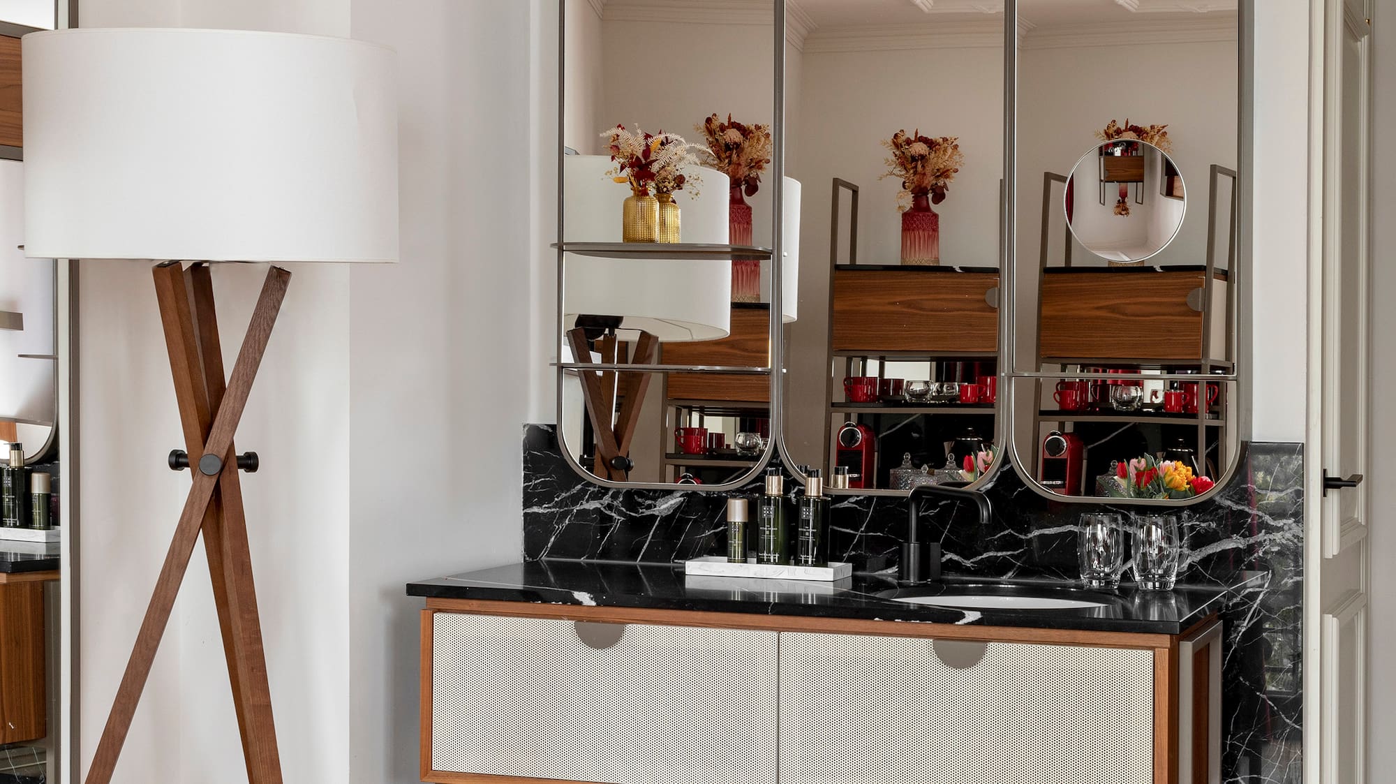 a bathroom with a mirror and a sink