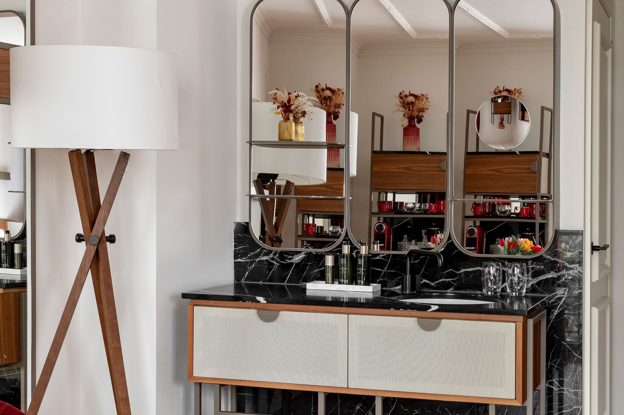 a bathroom with a mirror and a sink