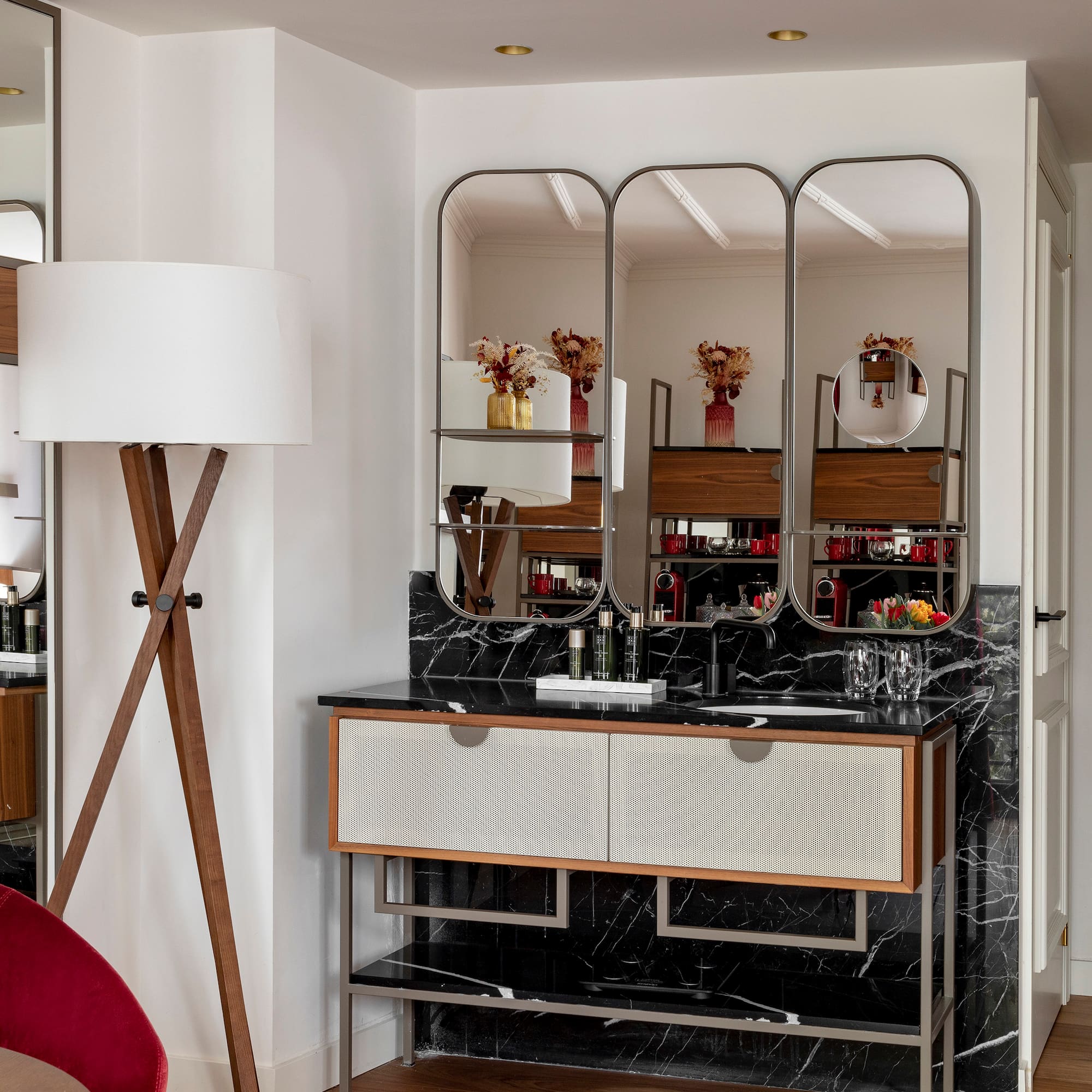 a bathroom with a mirror and a sink