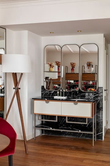 a bathroom with a mirror and a sink