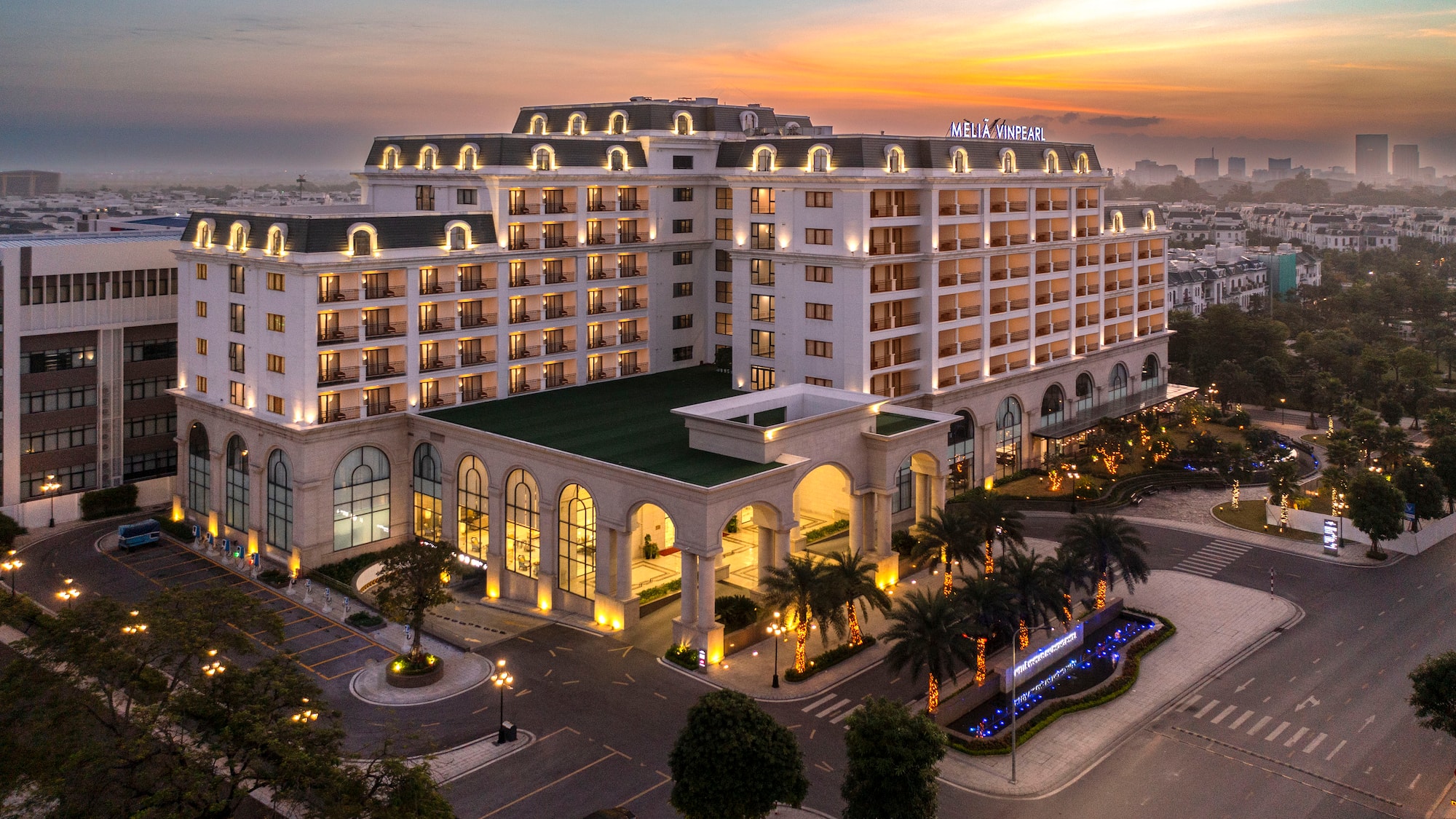 a large building with many windows and a parking lot