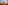 Golden Buddhist stupa wrapped in orange fabric under a hazy sun.