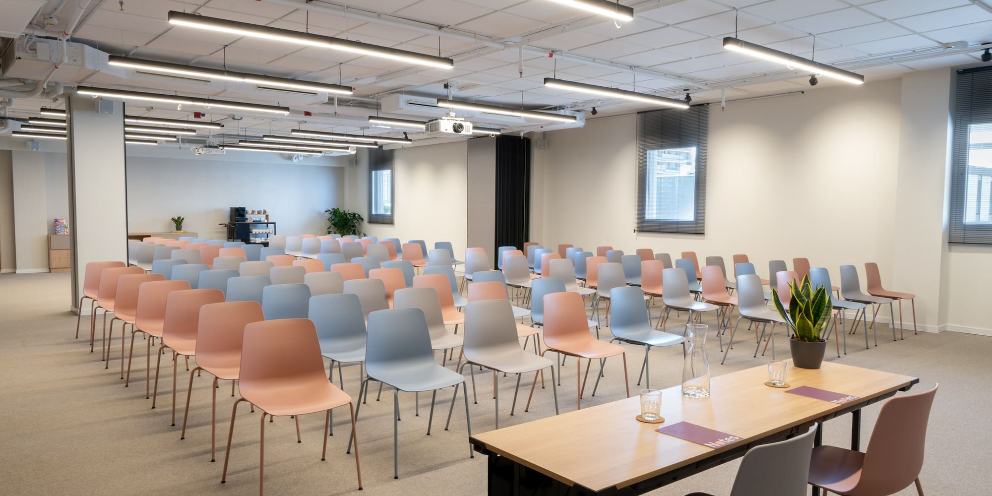 a room with many chairs and tables