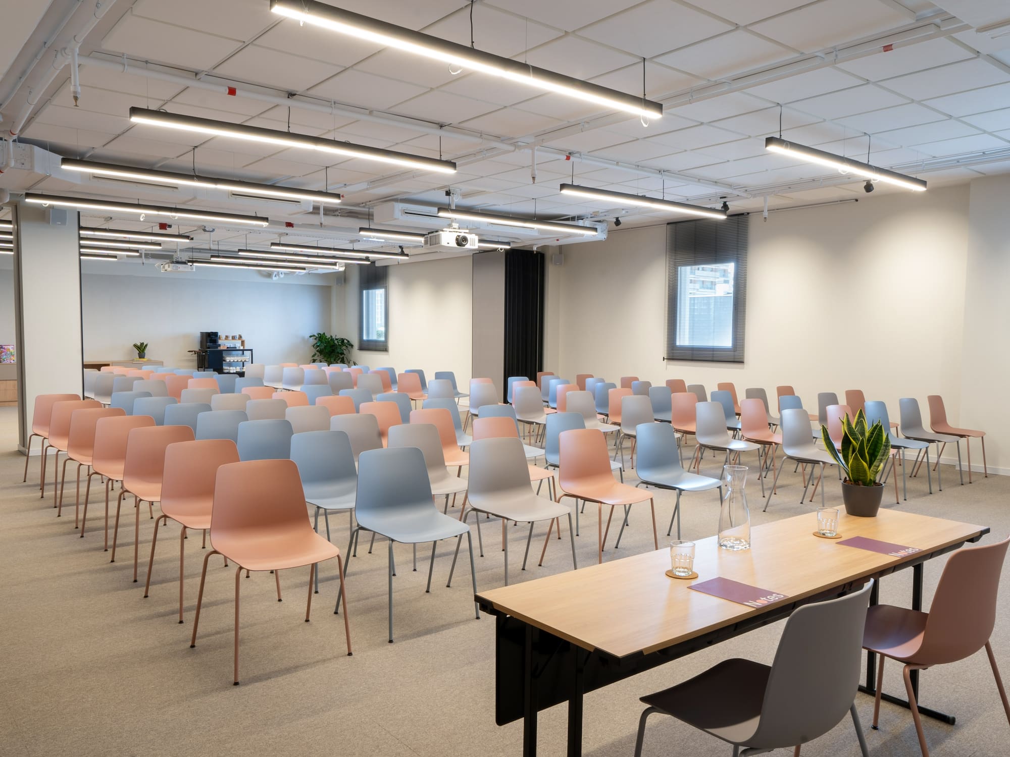 a room with many chairs and tables