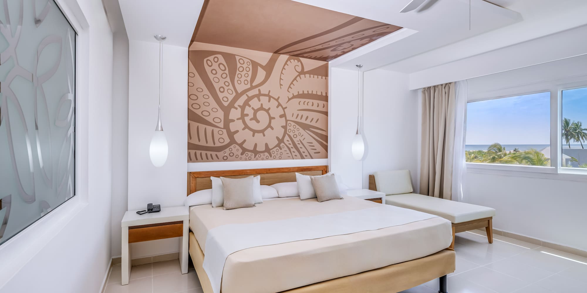 a room with a bed and a fan