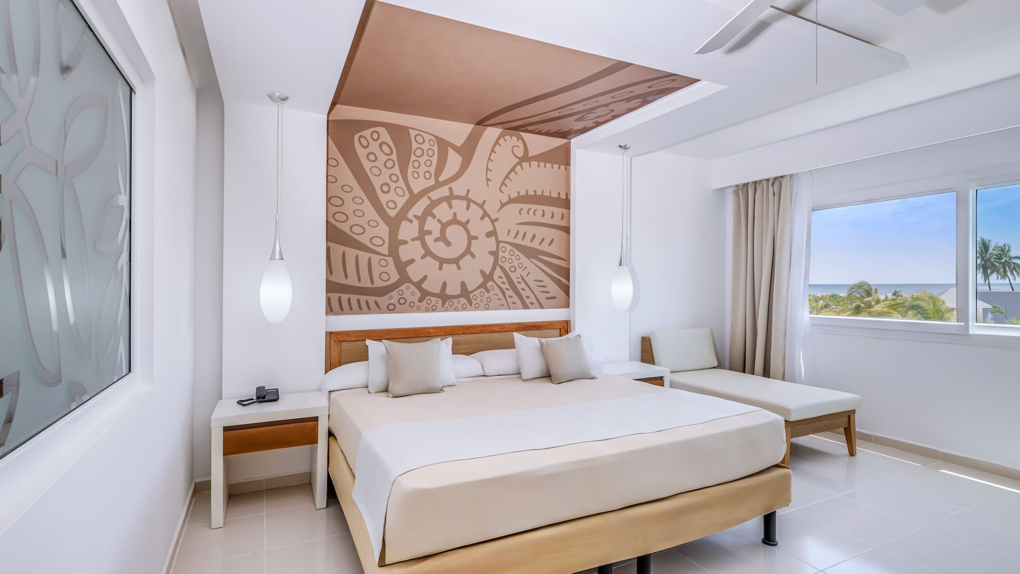 a room with a bed and a fan