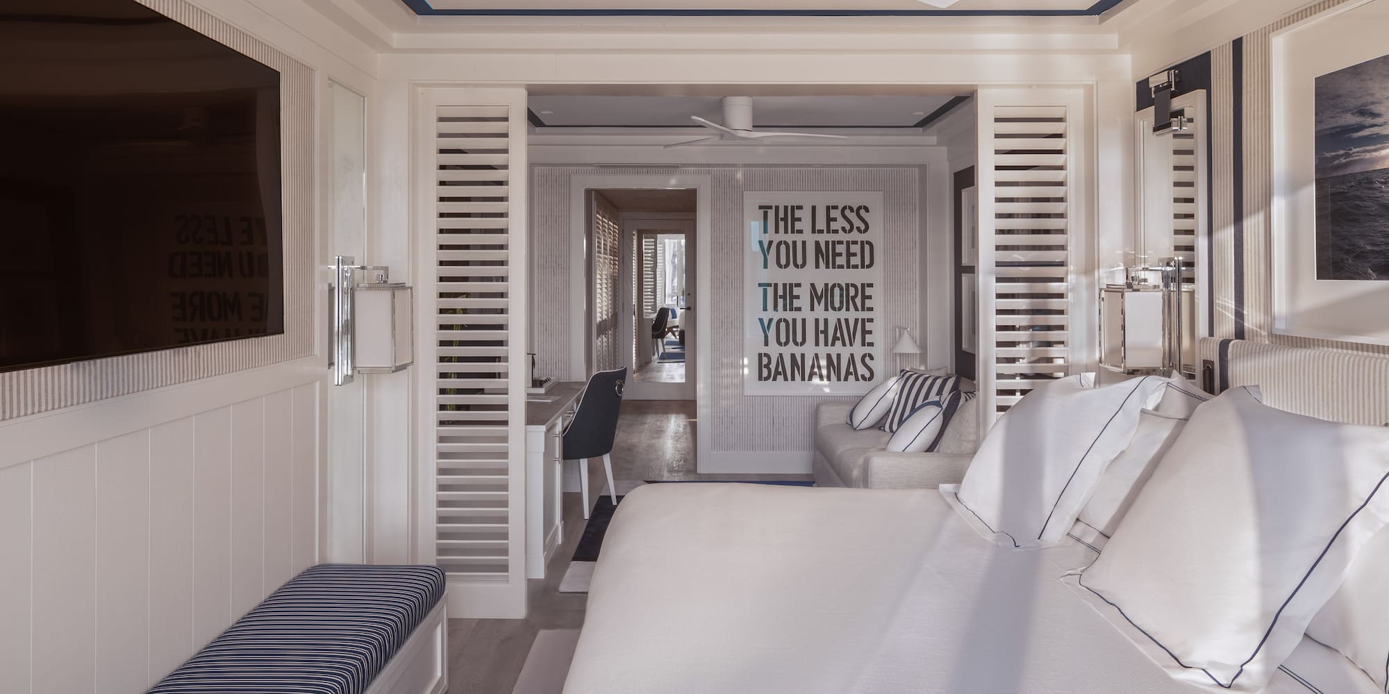 a room with a bed and a tv