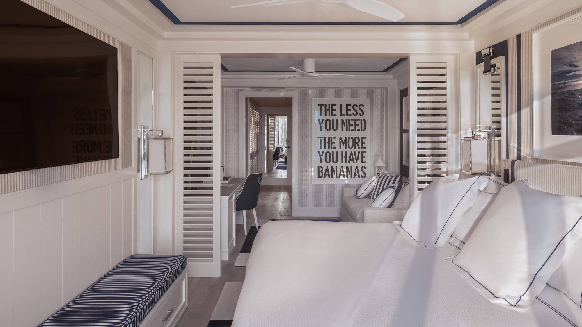 a room with a bed and a tv