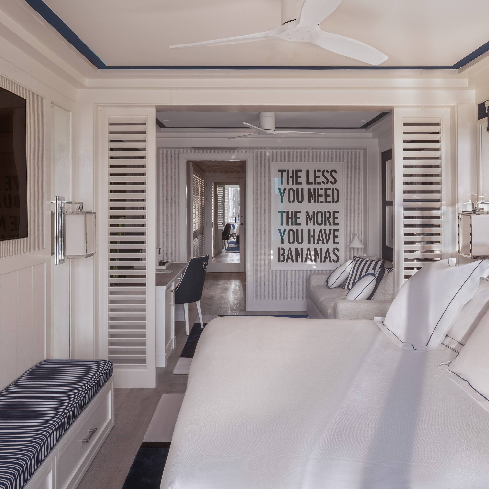 a room with a bed and a tv