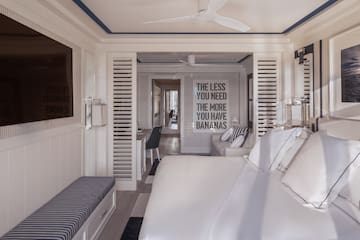 a room with a bed and a tv