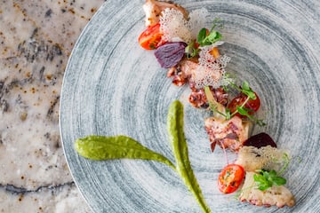 a plate of food on a marble surface