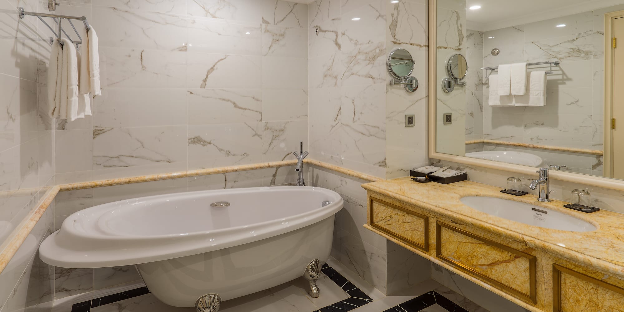 a bathroom with a tub and sink