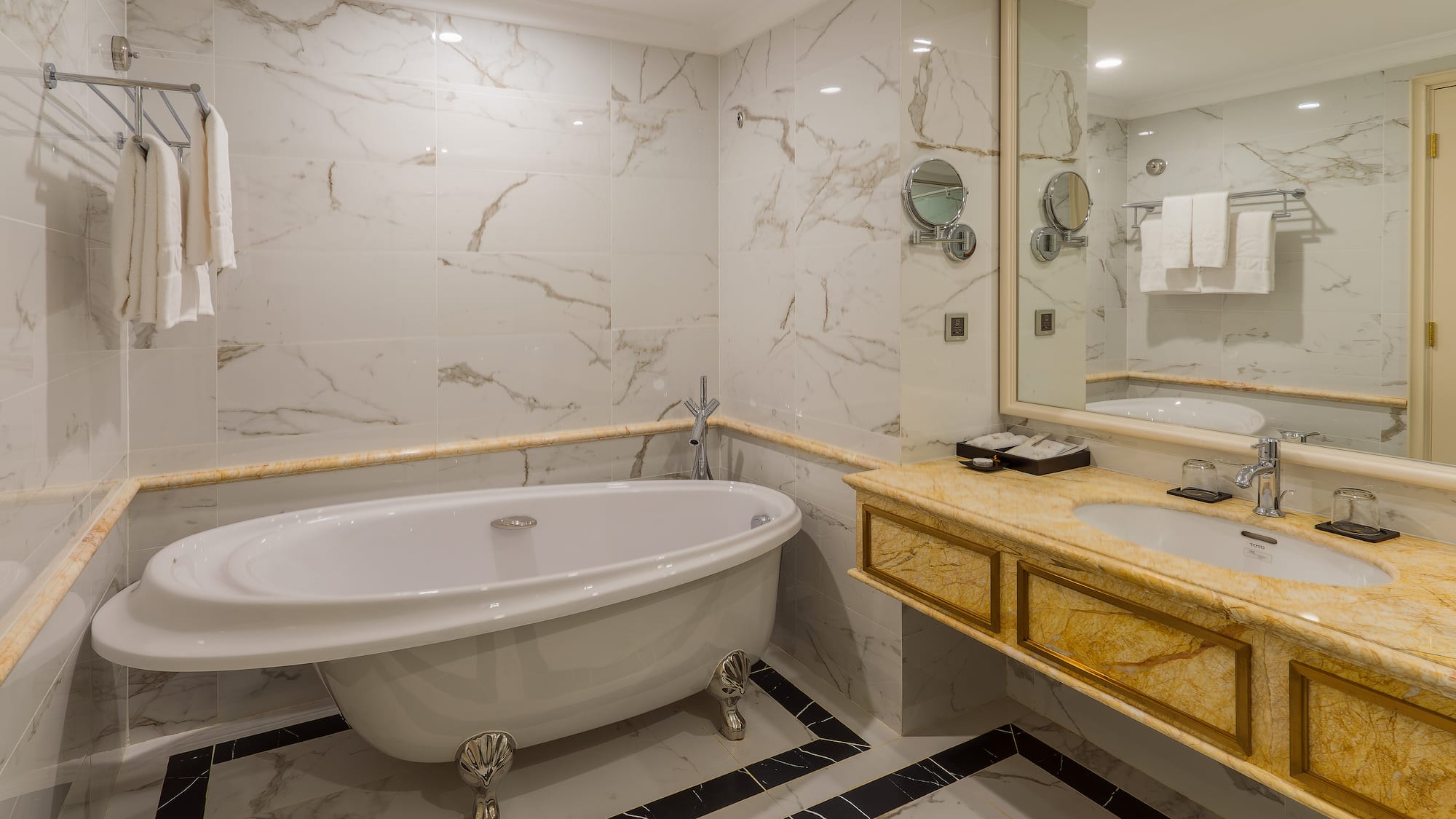 a bathroom with a tub and sink