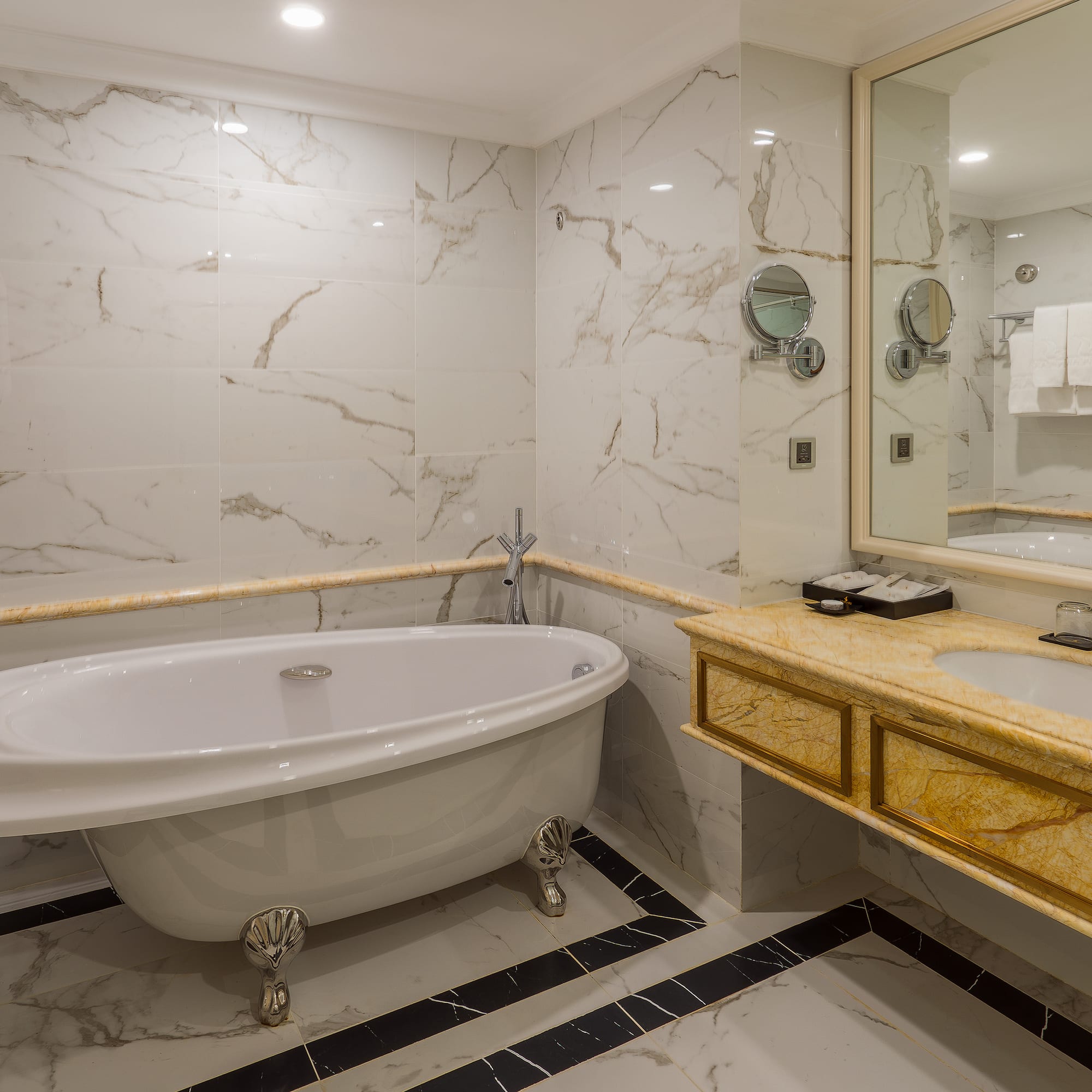 a bathroom with a tub and sink