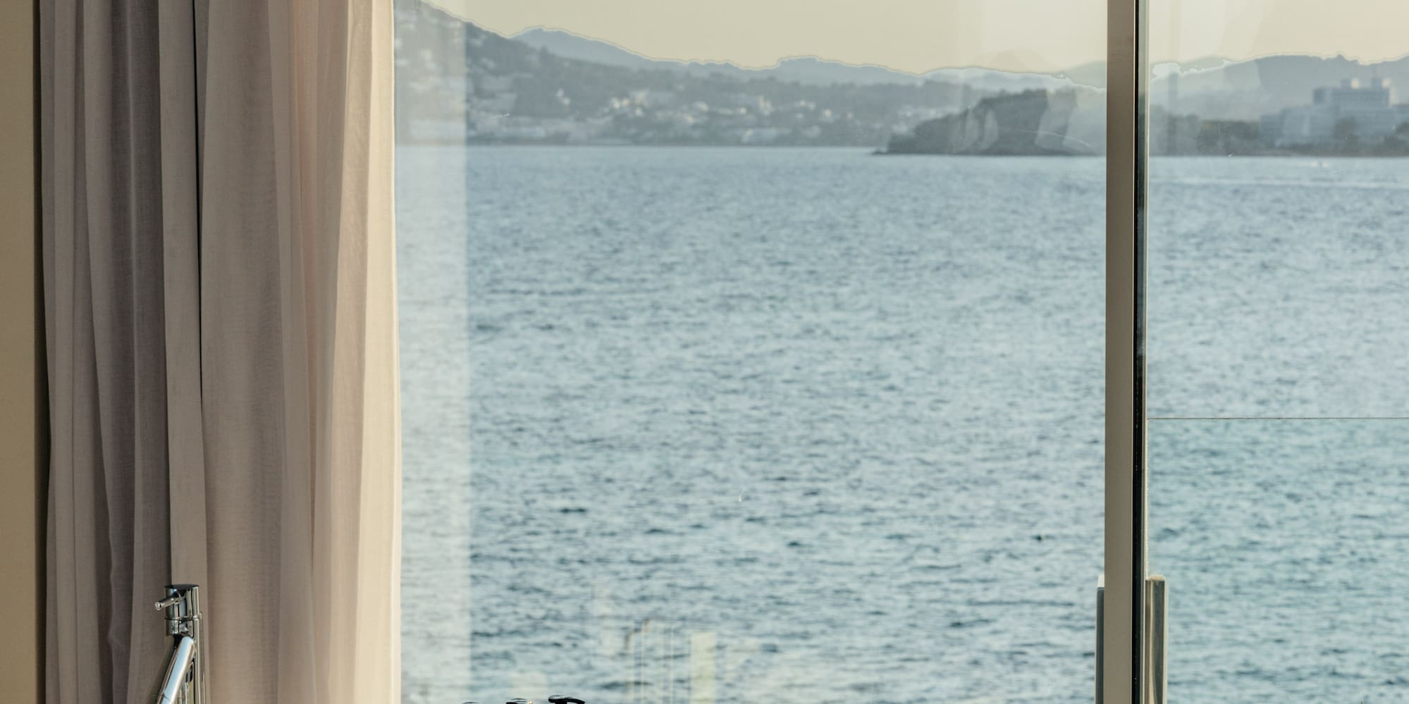 a bathtub with a view of the ocean