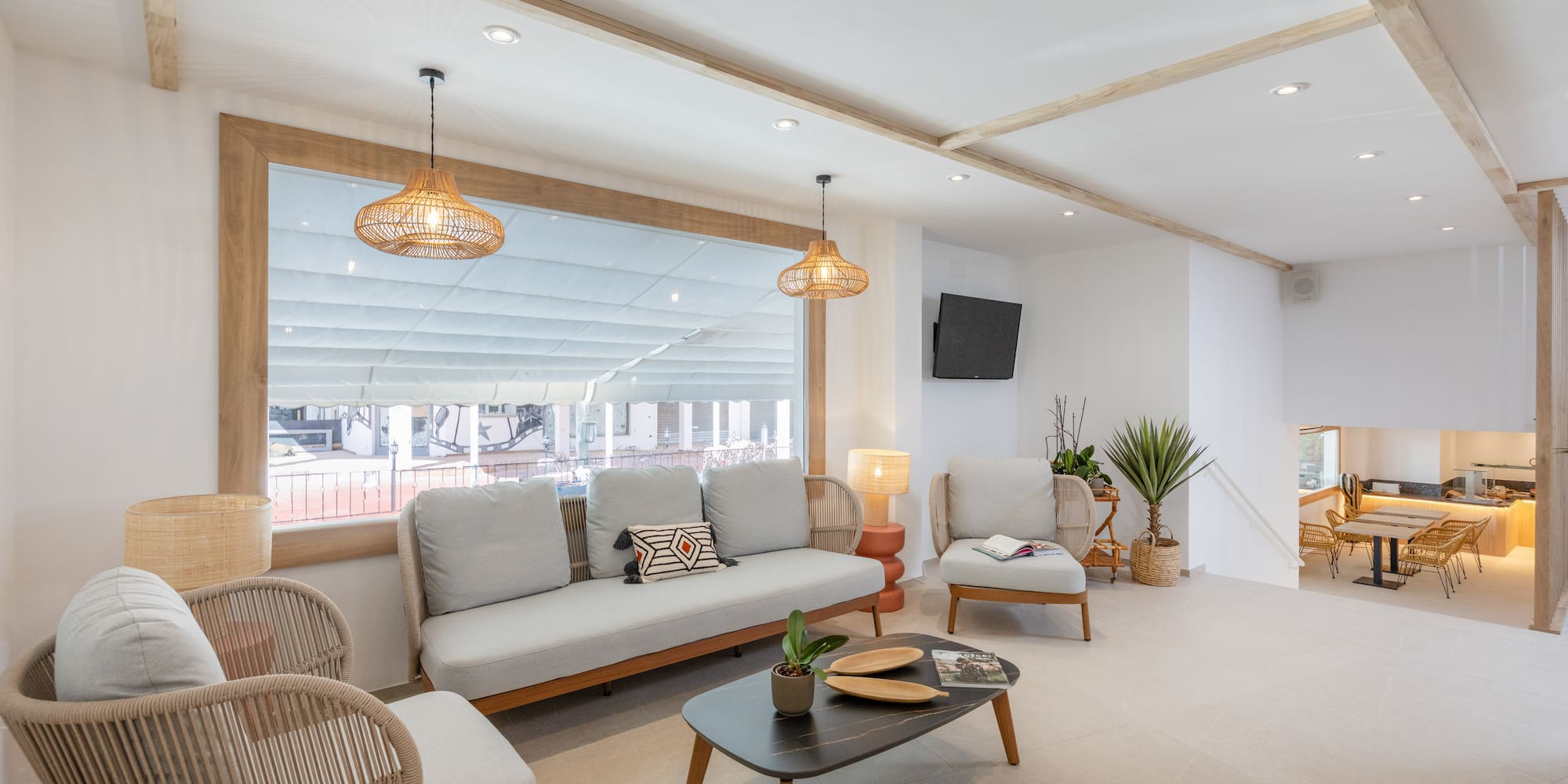 a room with a couch and chairs