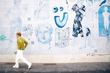 a man walking on the sidewalk