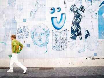 a man walking on the sidewalk