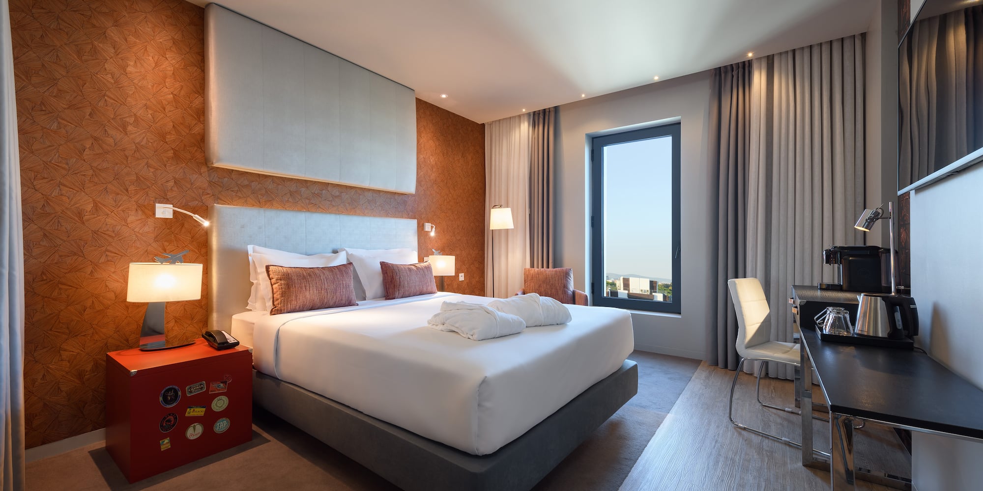 a room with a bed and a desk