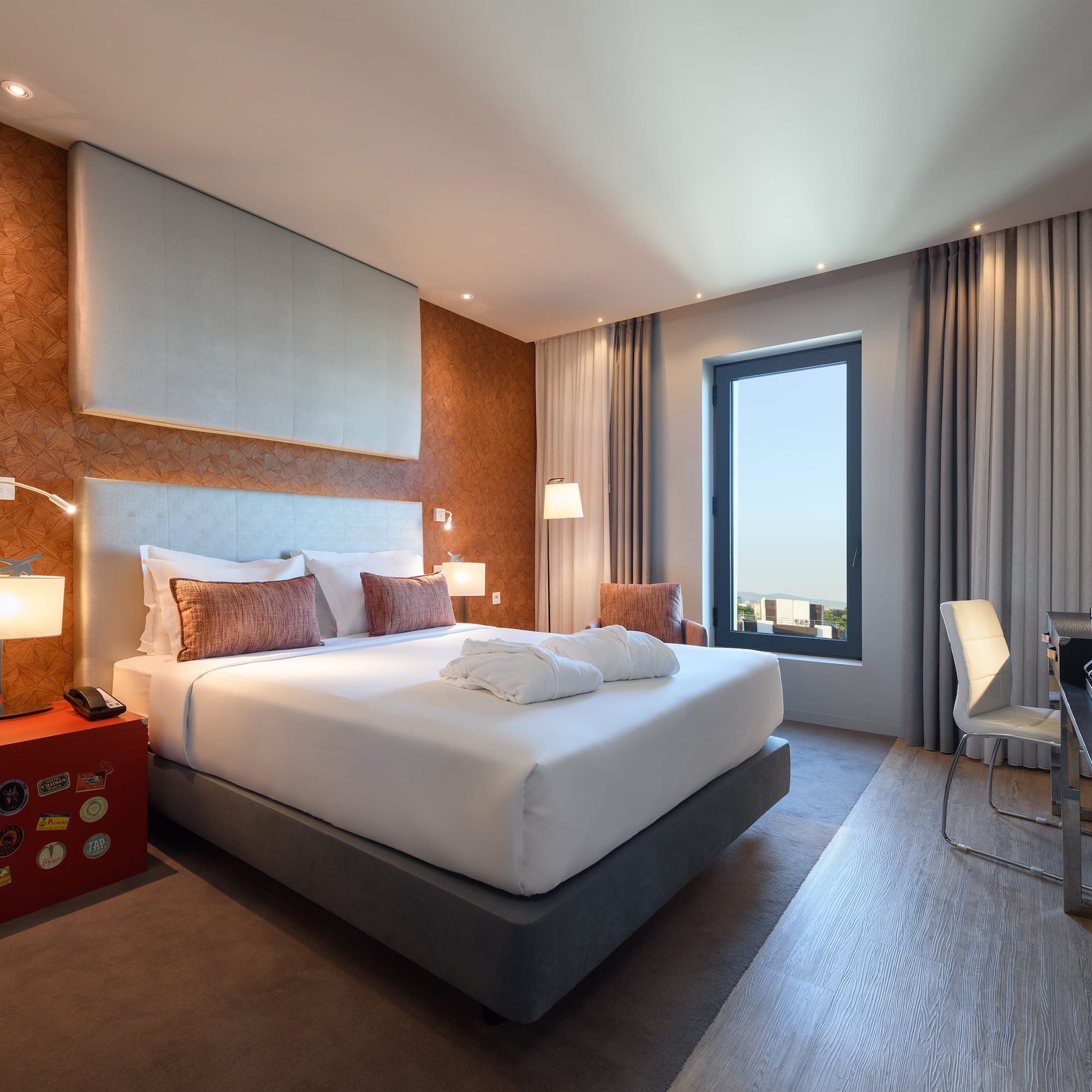 a room with a bed and a desk