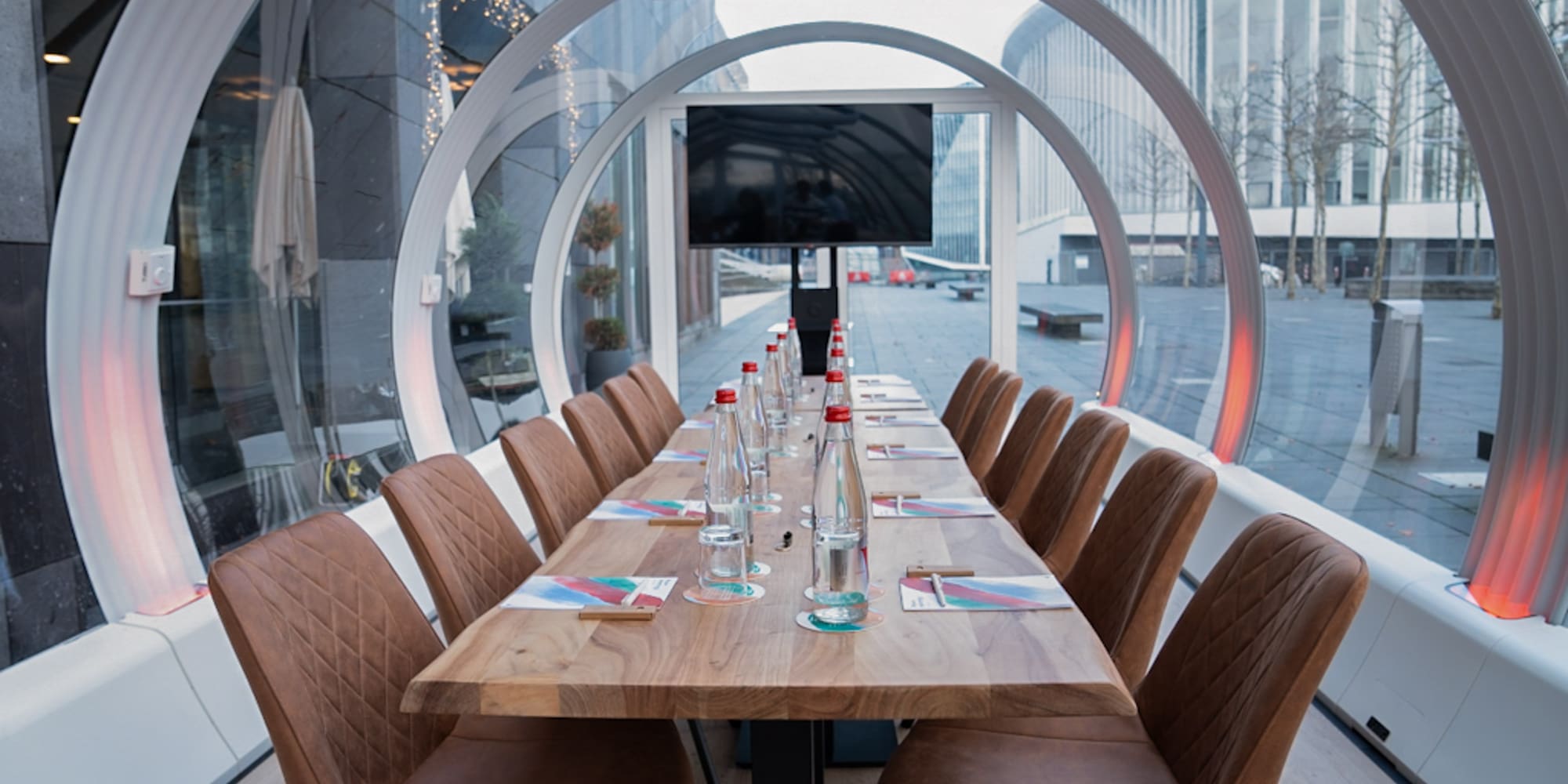 a table with chairs and a television on it