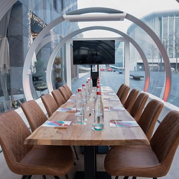 a table with chairs and a television on it