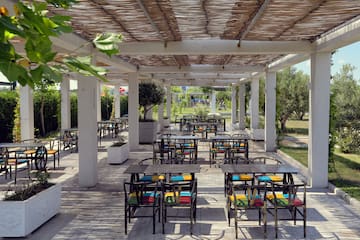 a patio with tables and chairs