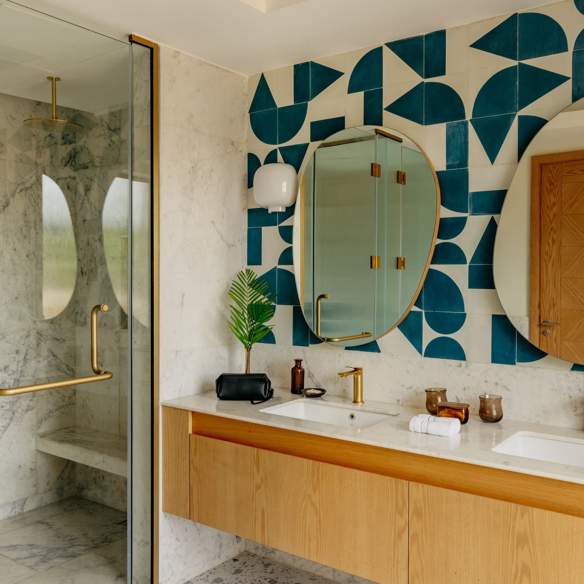 a bathroom with a shower and a mirror