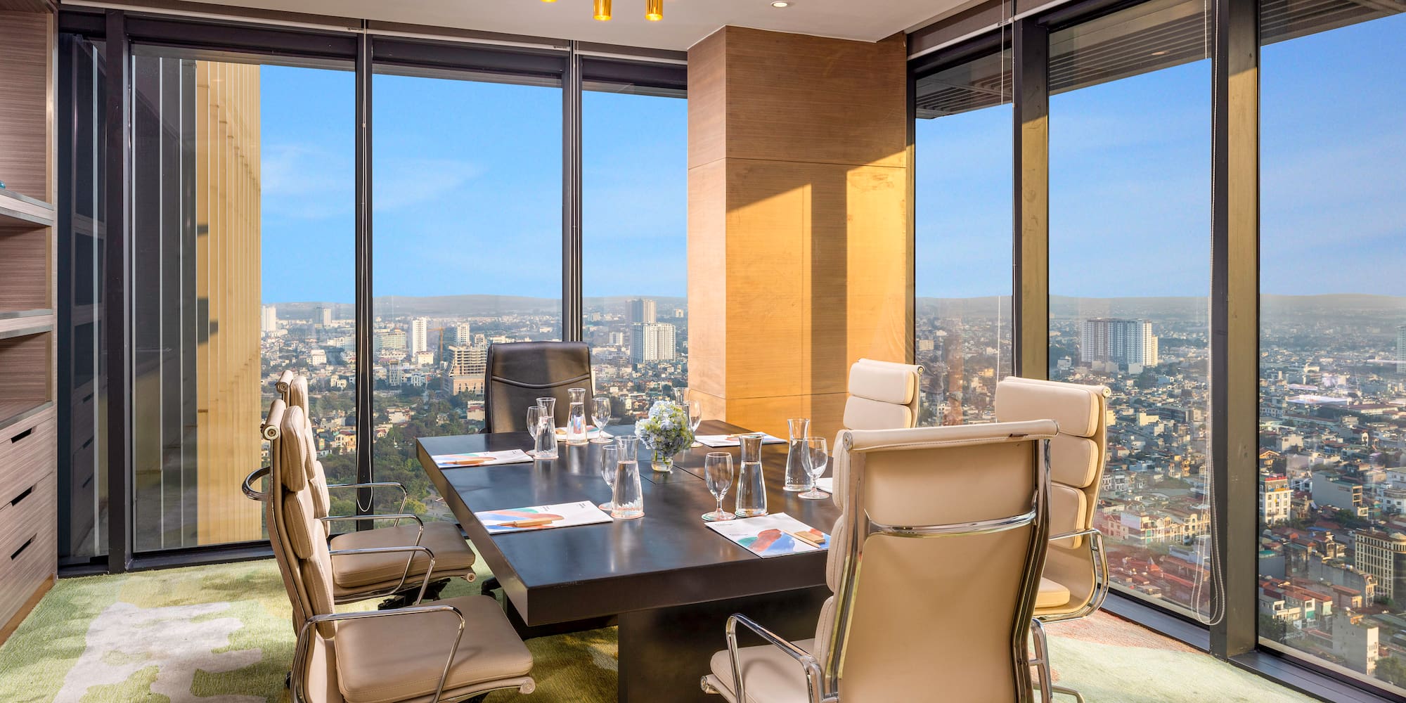 a conference room with a table and chairs