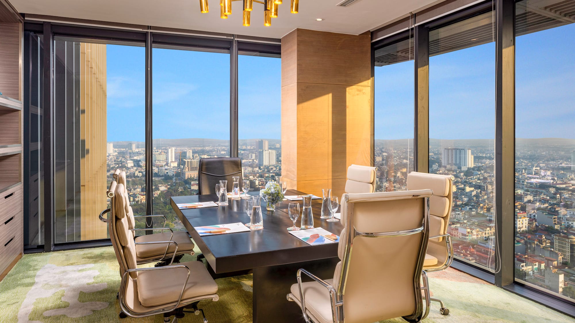 a conference room with a table and chairs