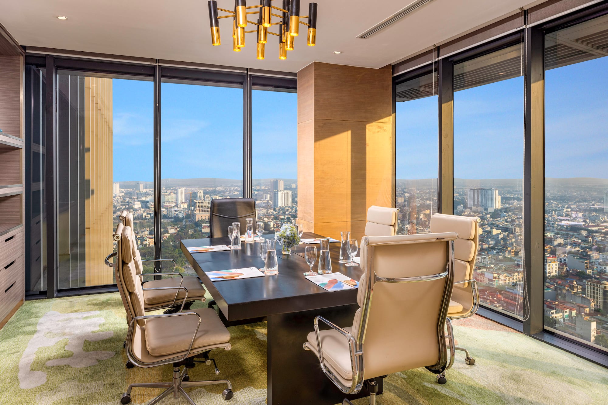 a conference room with a table and chairs