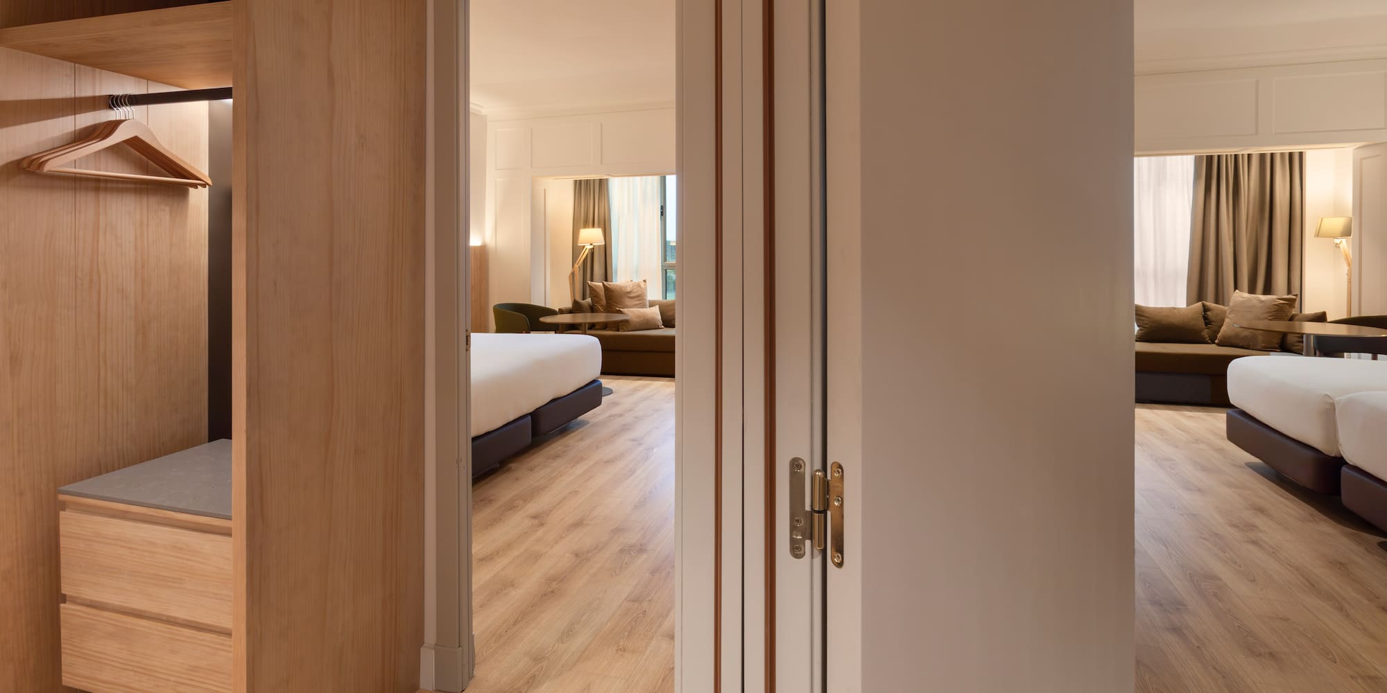 a room with a bed and a bed and a couch