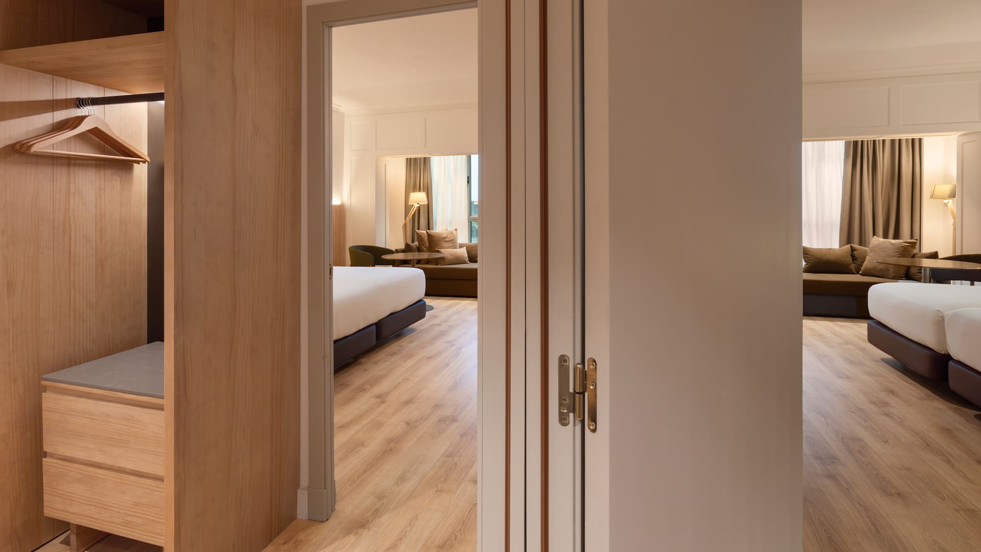 a room with a bed and a bed and a couch