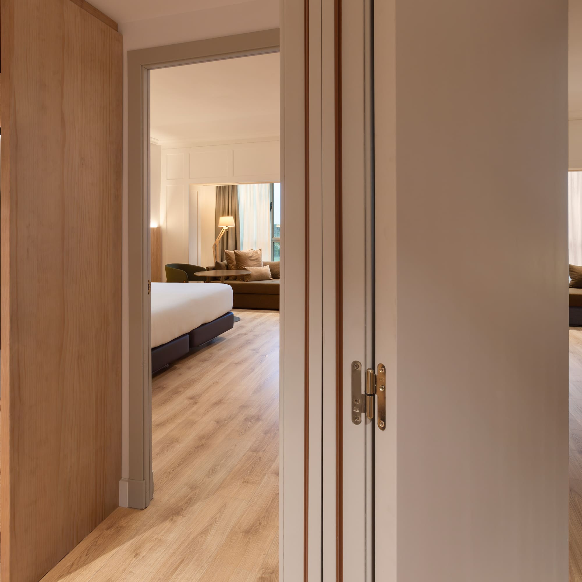 a room with a bed and a bed and a couch