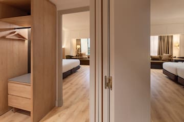 a room with a bed and a bed and a couch