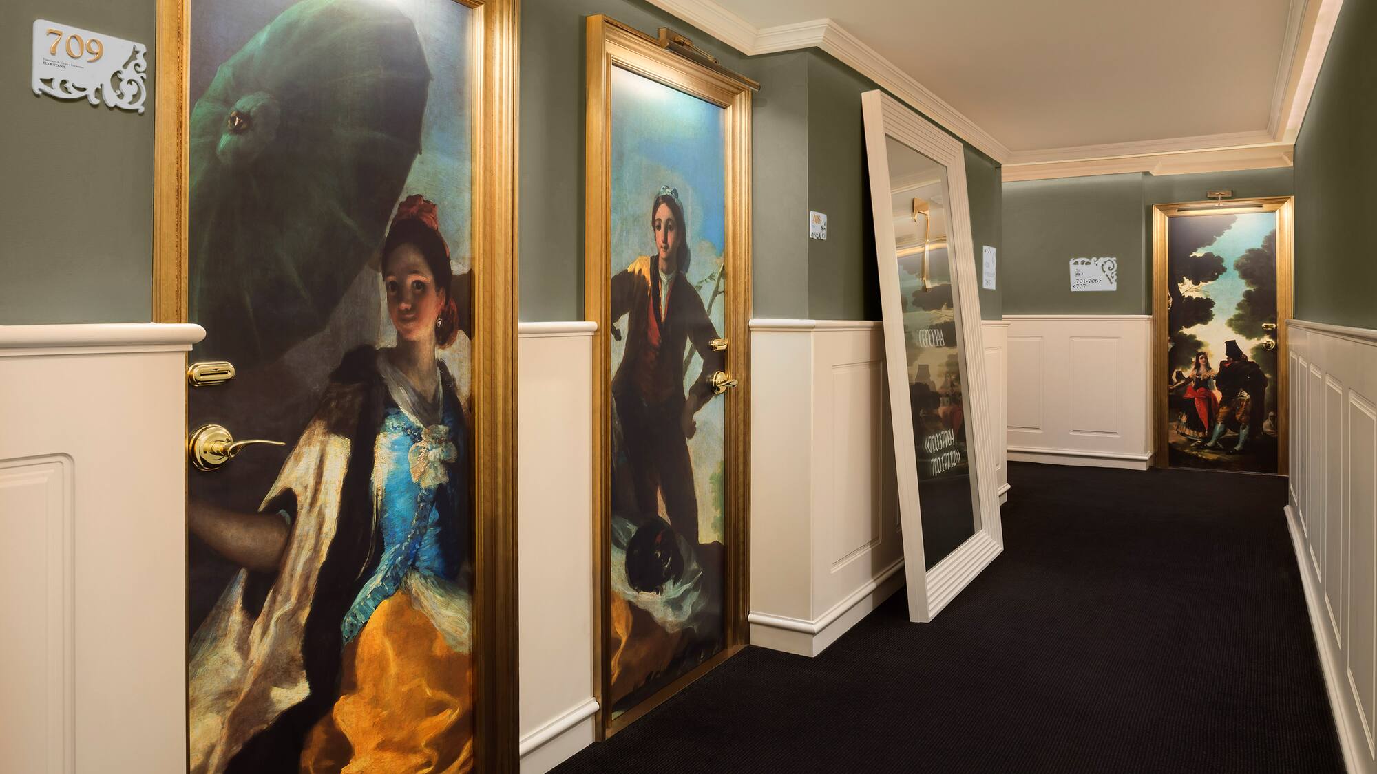 a hallway with paintings on the wall