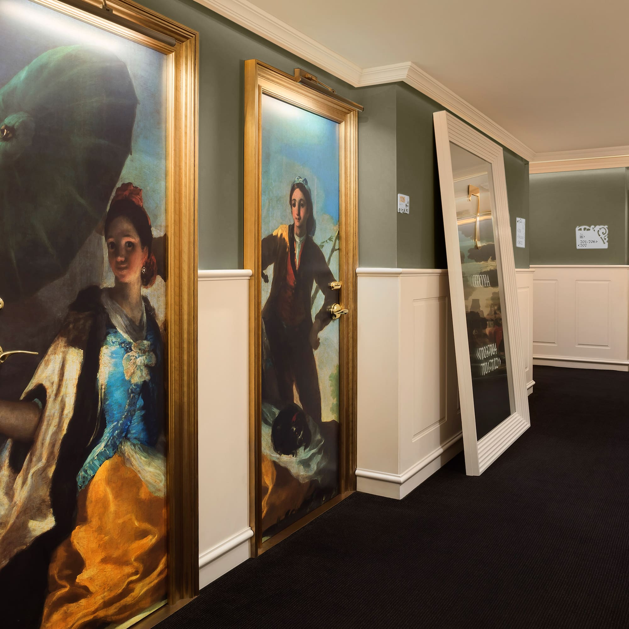 a hallway with paintings on the wall