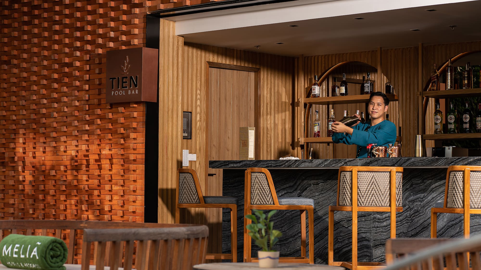 a man standing at a bar