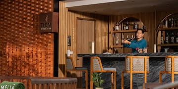 a man standing at a bar