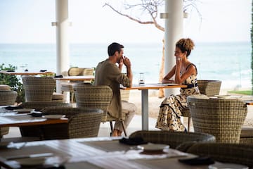 a man and woman sitting at a table