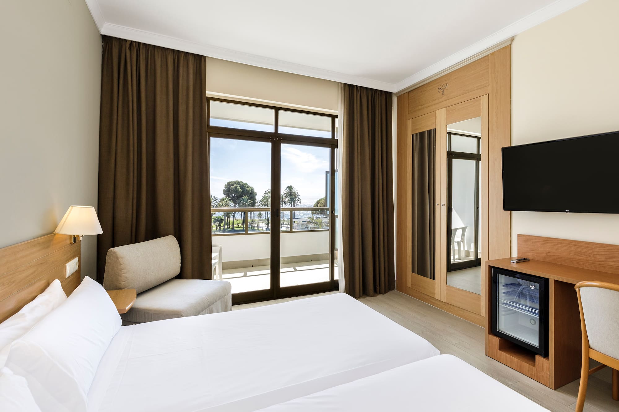 a room with a television and two beds