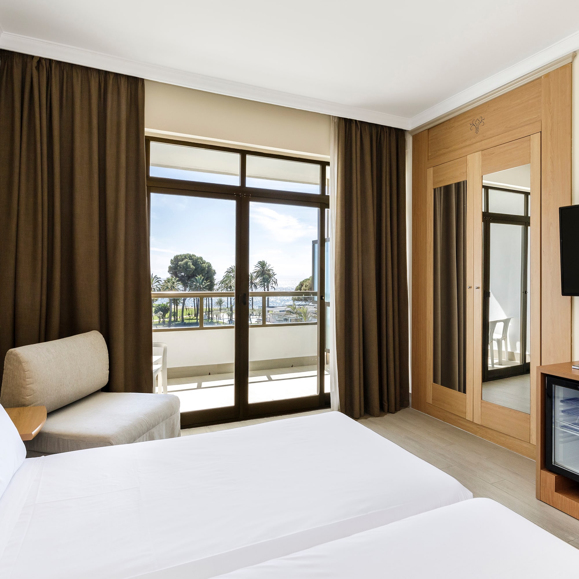 a room with a television and two beds