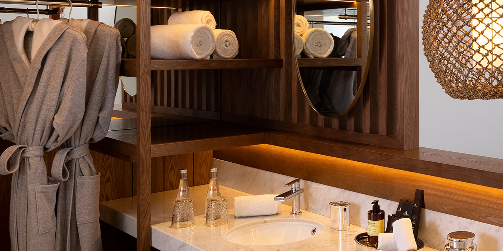 a bathroom with a mirror and towels