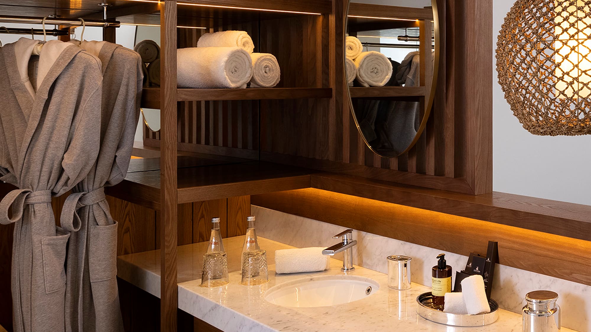a bathroom with a mirror and towels