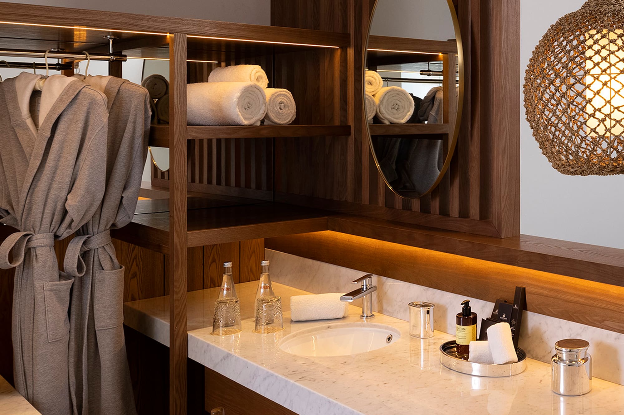 a bathroom with a mirror and towels