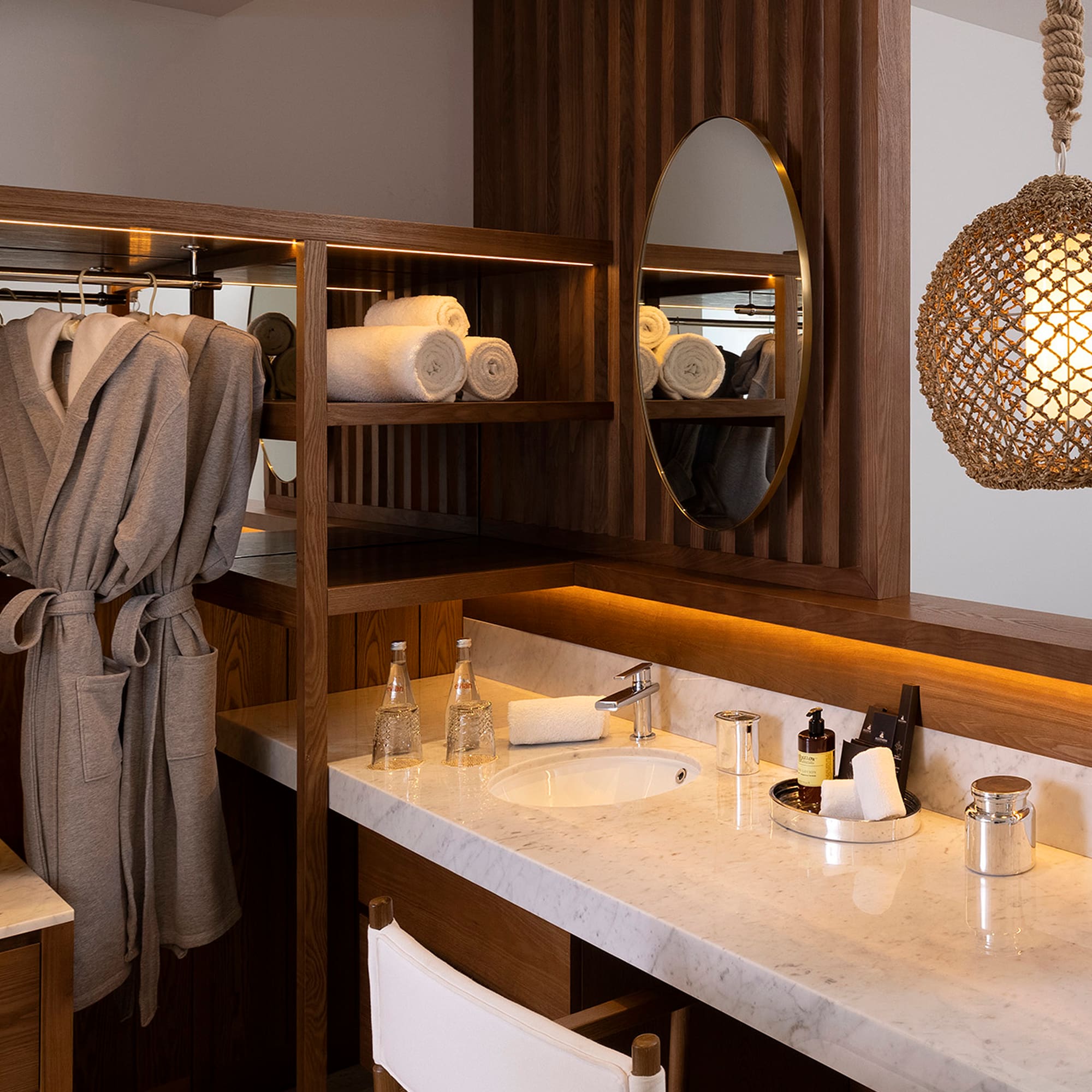 a bathroom with a mirror and towels