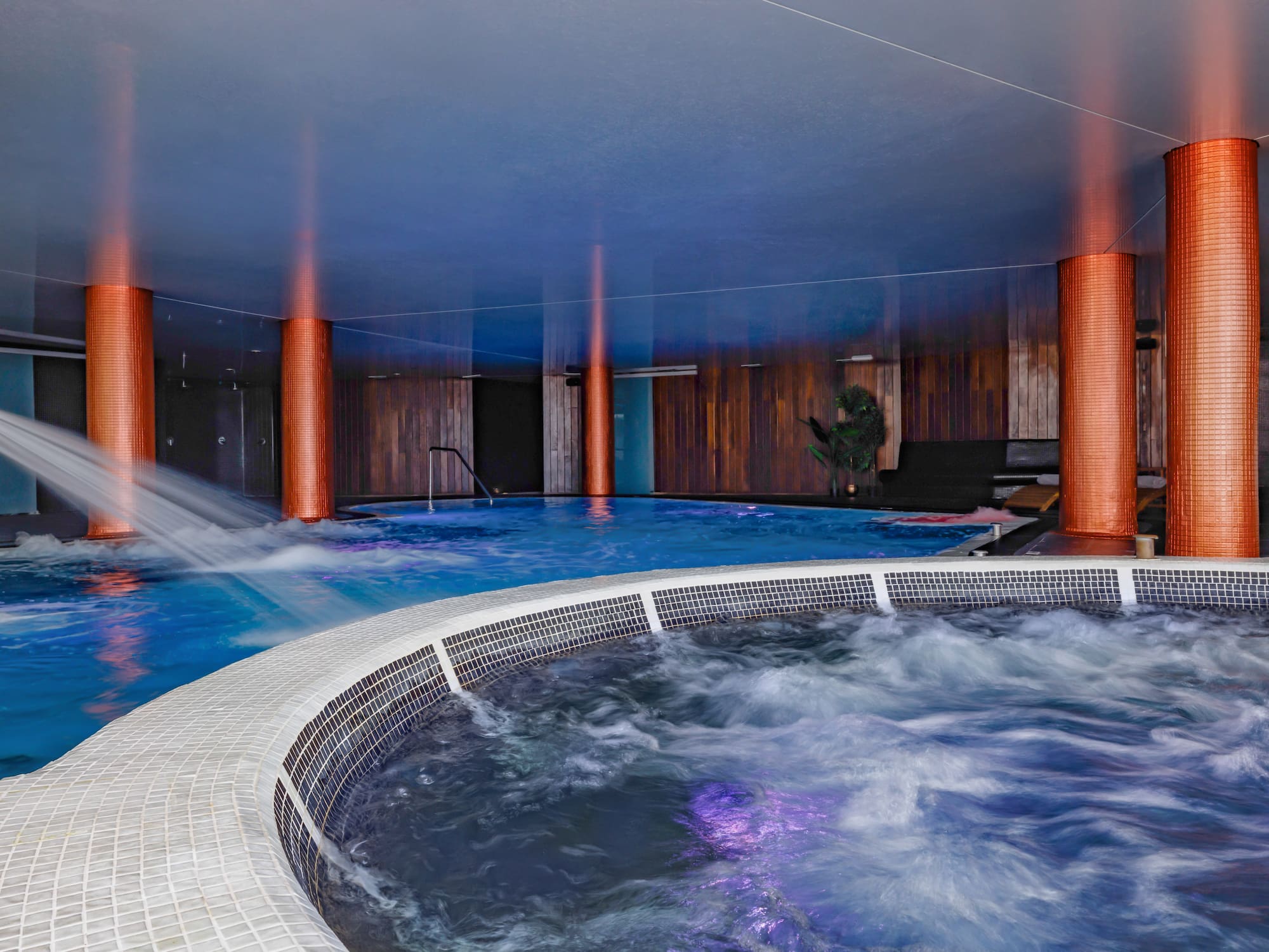 a large indoor jacuzzi with a hot tub
