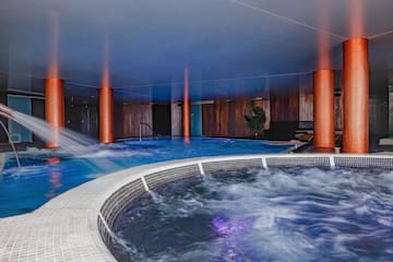 a large indoor jacuzzi with a hot tub