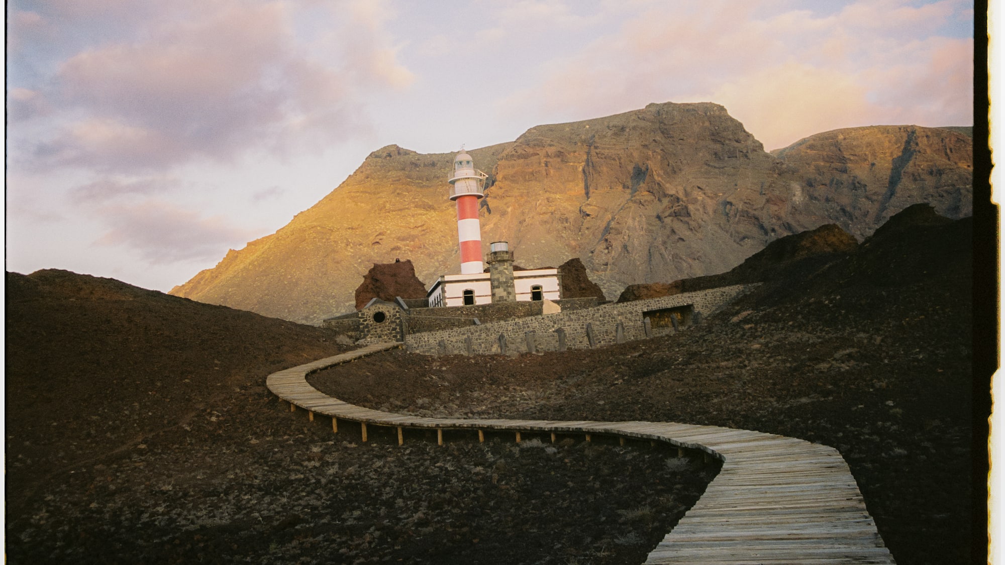 a path leading to a lighthouse