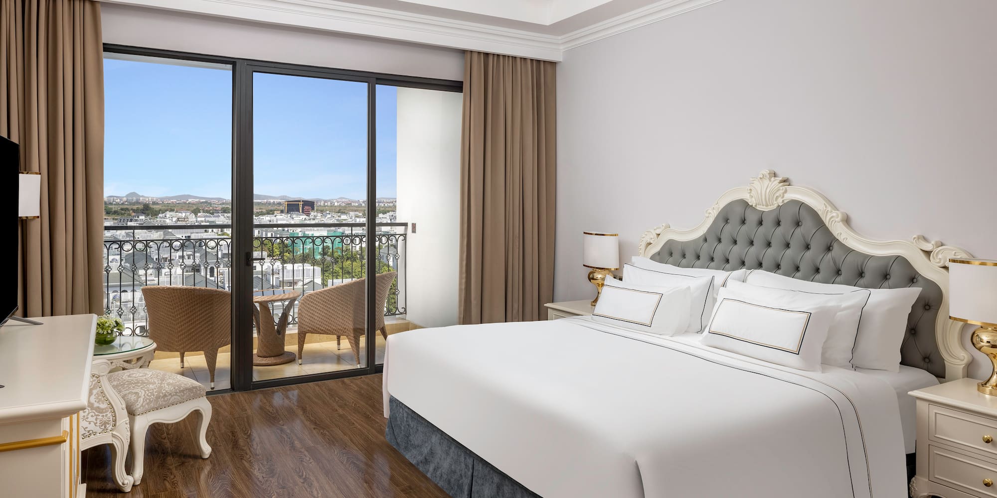 a bedroom with a large window and a balcony